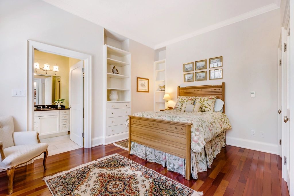 A guest room with two beds and a window