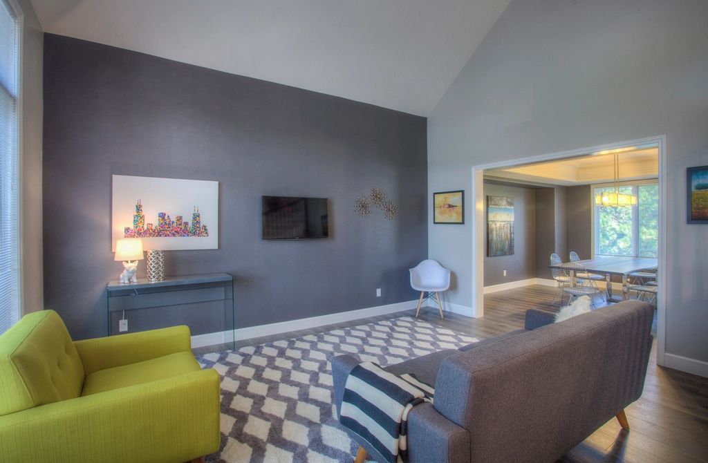 A suite sitting room with a sofa and armchairs